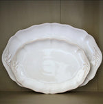 SC Hospitality Costa Nova Alentejo white stoneware oval platters with wavy edges and hand-painted leaf details