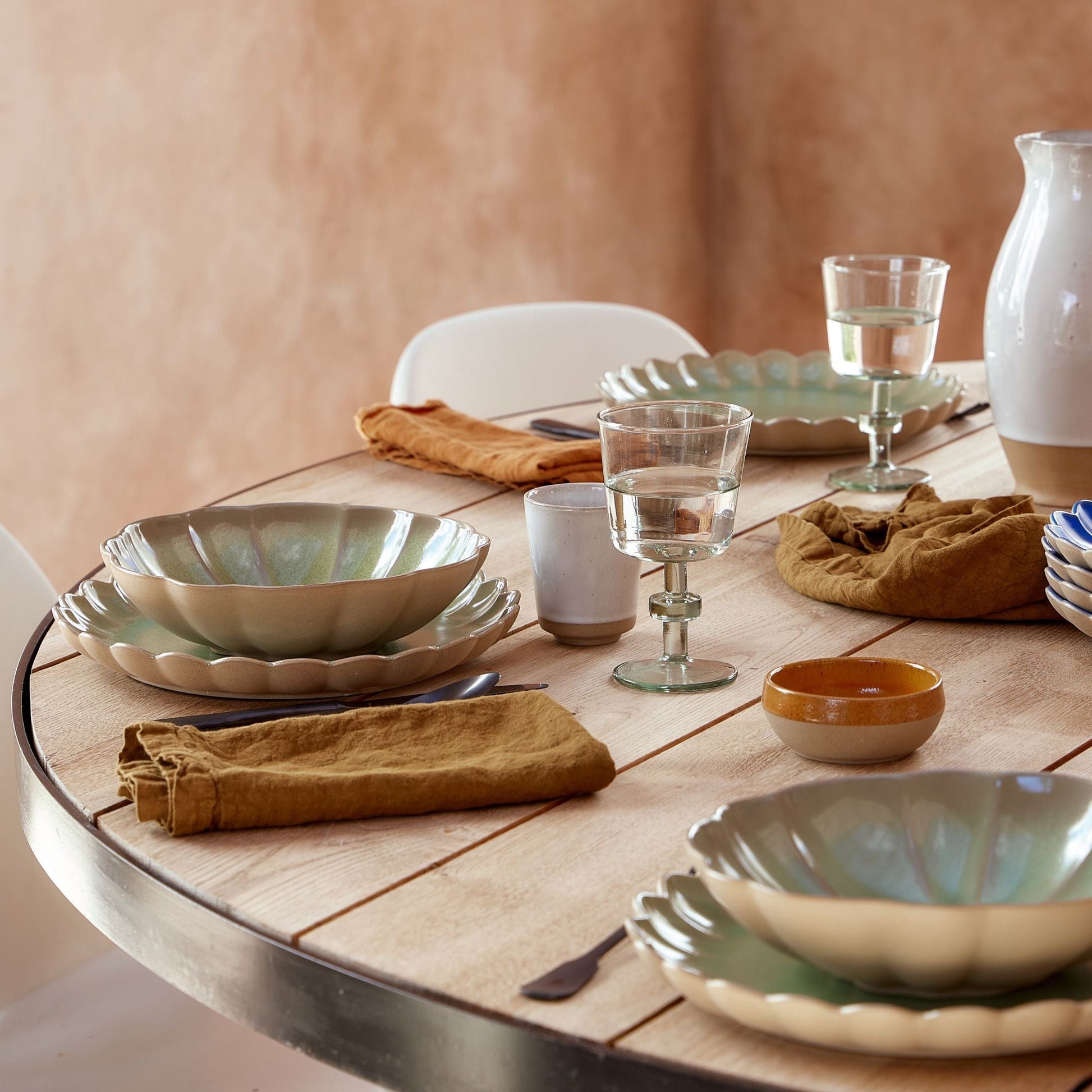 SC Hospitality Marrakesh 10cm cumin stoneware dip bowl on a rustic wooden dining table with matching tableware