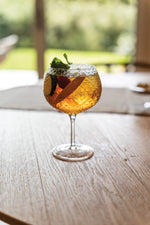 SC Hospitality Zafferano Mixology balloon goblet filled with a cocktail, featuring a textured geometric glass design.