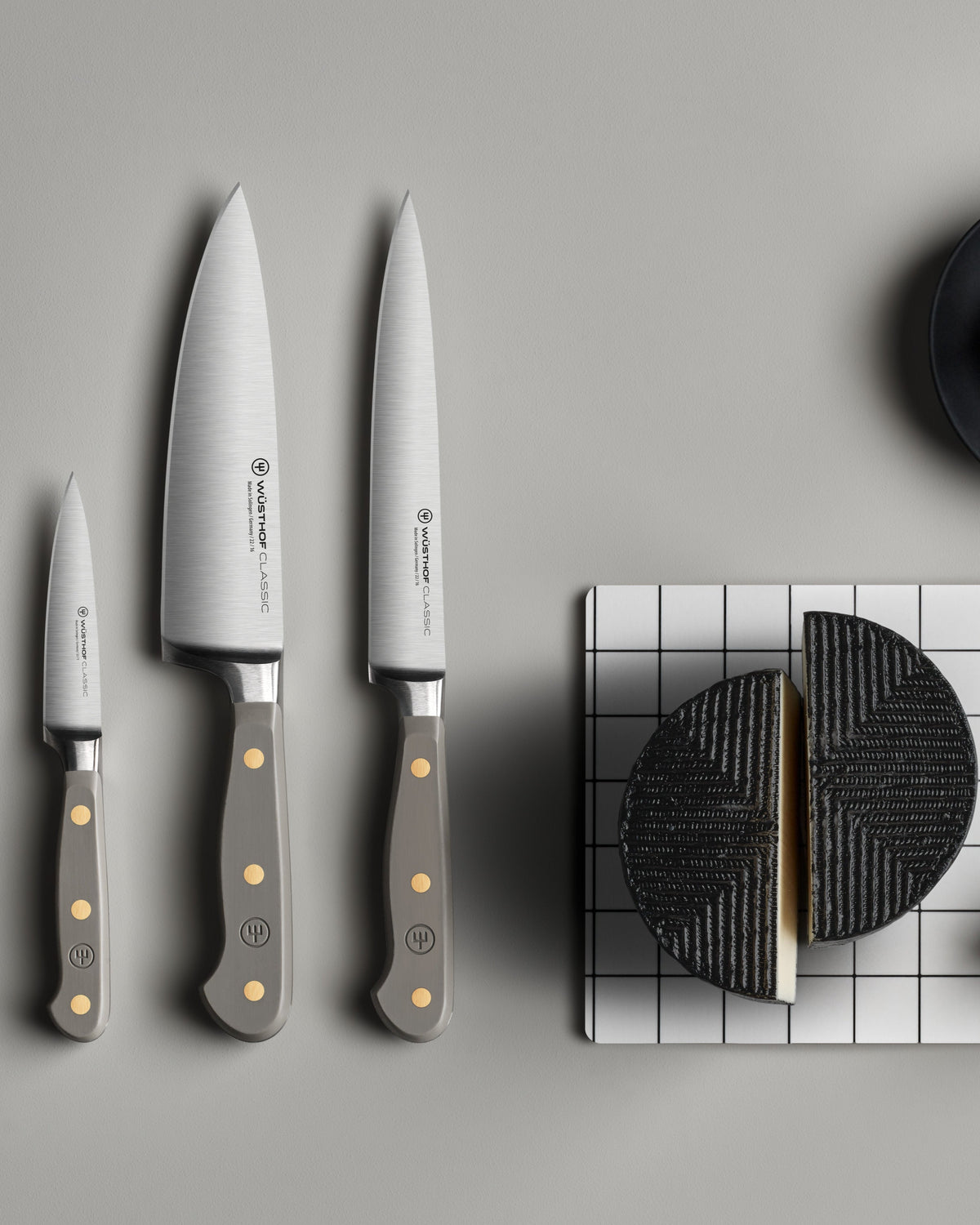 SC Hospitality Wüsthof Classic Velvet Oyster knives with grey synthetic handles and stainless steel blades on a table