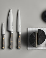 SC Hospitality Wüsthof Classic Velvet Oyster knives with grey synthetic handles and stainless steel blades on a table