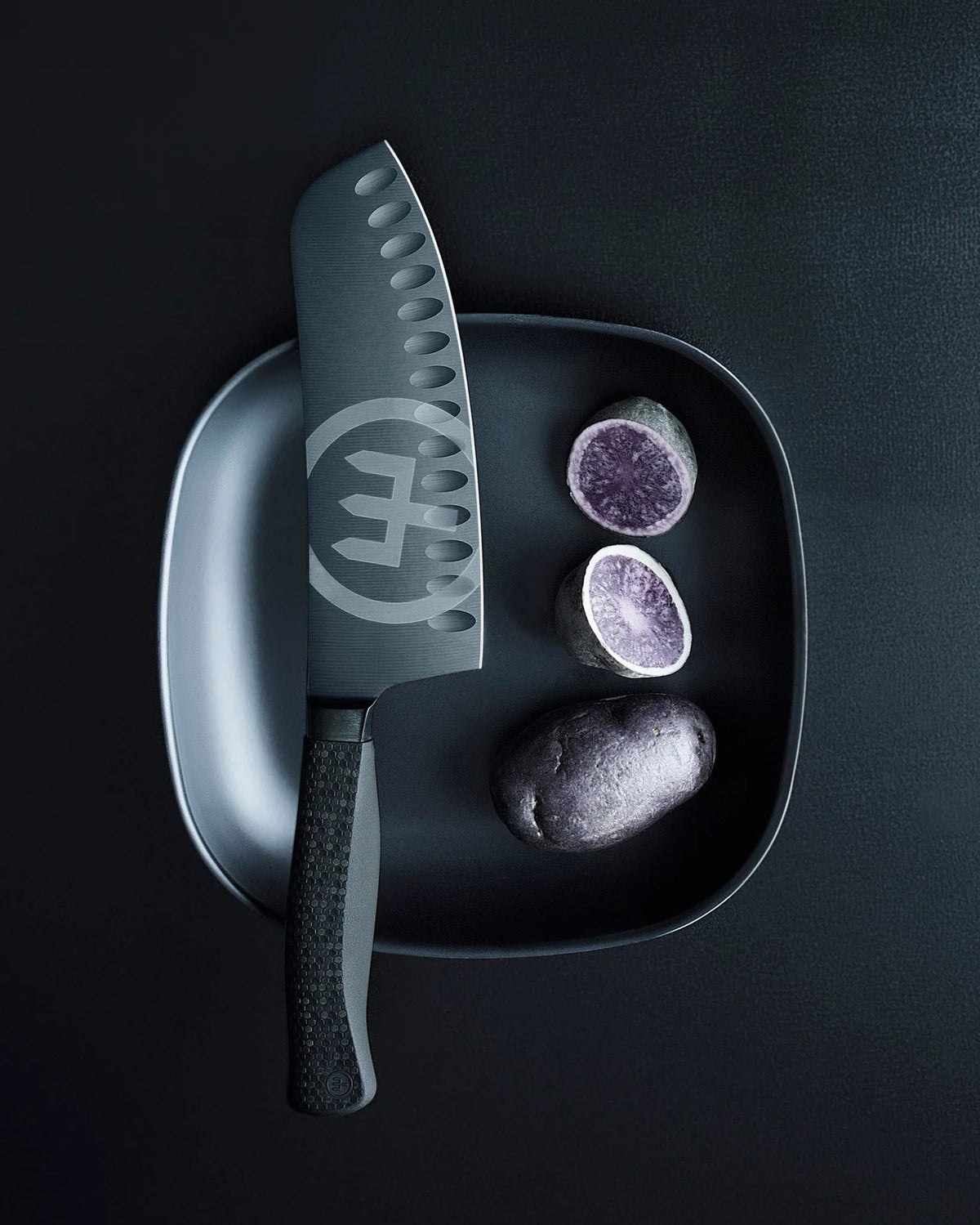 SC Hospitality WÜSTHOF Performer 17cm Rotoku knife with matte-black DLC coating and textured hexagon power grip handle.