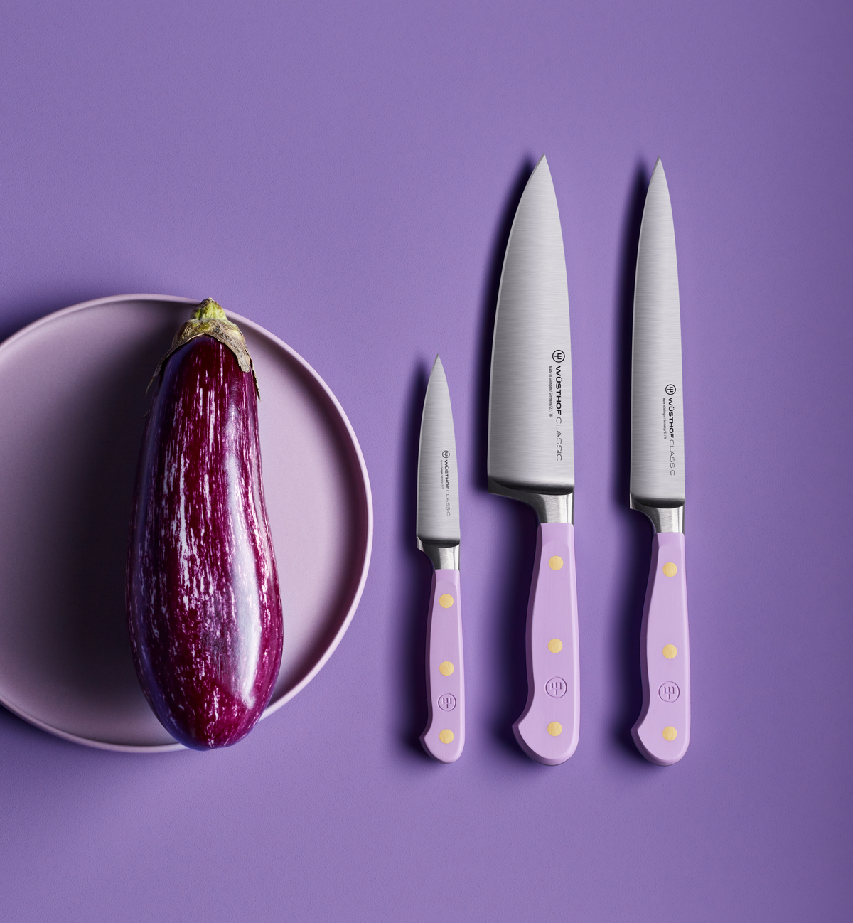 SC Hospitality Wüsthof Purple Yam cook's knife set with stainless steel blades and ergonomic light purple handles.