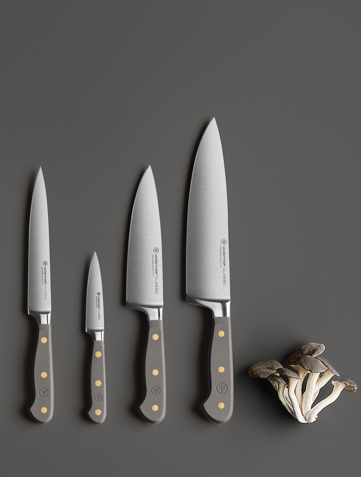 SC Hospitality Wüsthof Velvet Oyster paring and chef knife set with grey synthetic handles on a dark surface