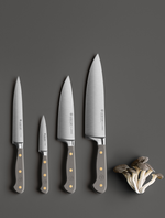 SC Hospitality Wüsthof Velvet Oyster paring and chef knife set with grey synthetic handles on a dark surface