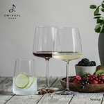 SC Hospitality Zwiesel Sensa crystal wine glasses and tumbler with lime water and fresh berries on a wooden table.